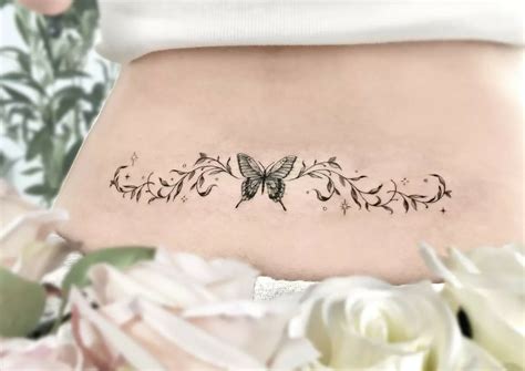 Butterfly lower back tattoo